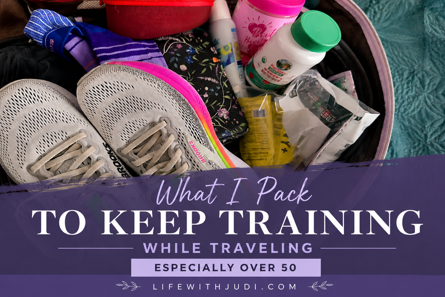Running shoes and travel essentials packed in a suitcase for keeping training consistent while traveling after 50.